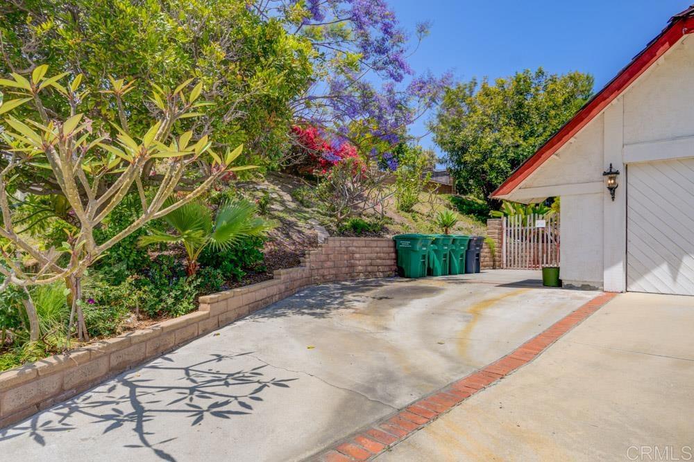 1706 Catalpa Road Carlsbad, CA 92011 - Photo 3 of 30 a front view of a house with a yard and garage