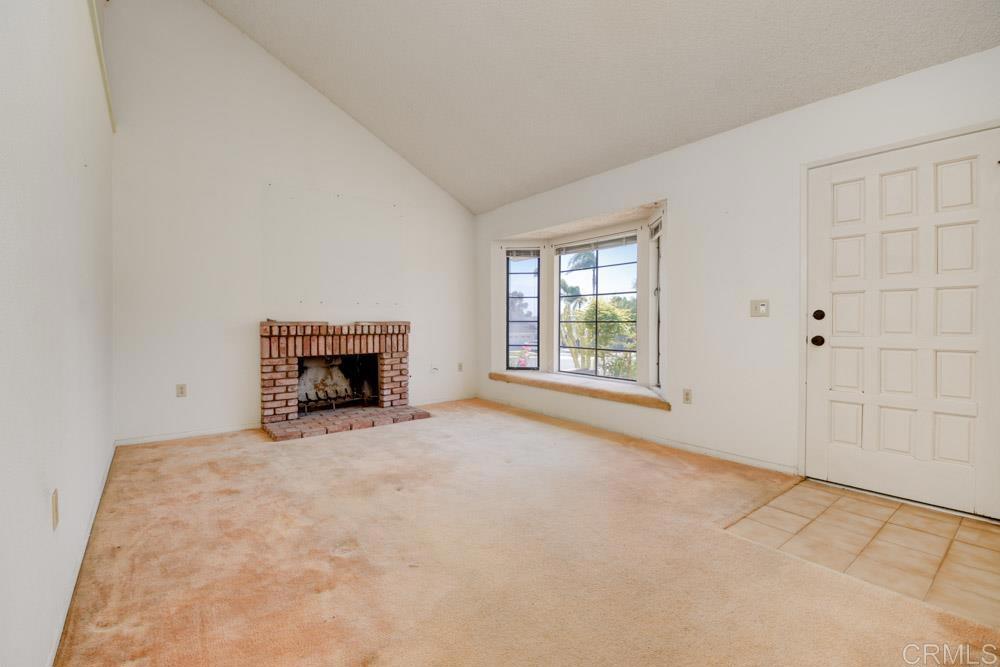1706 Catalpa Road Carlsbad, CA 92011 - Photo 5 of 30 an empty room with windows