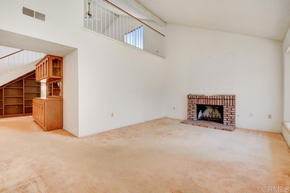 1706 Catalpa Road Carlsbad, CA 92011 - Photo 6 of 30 a view of an empty room with a fireplace