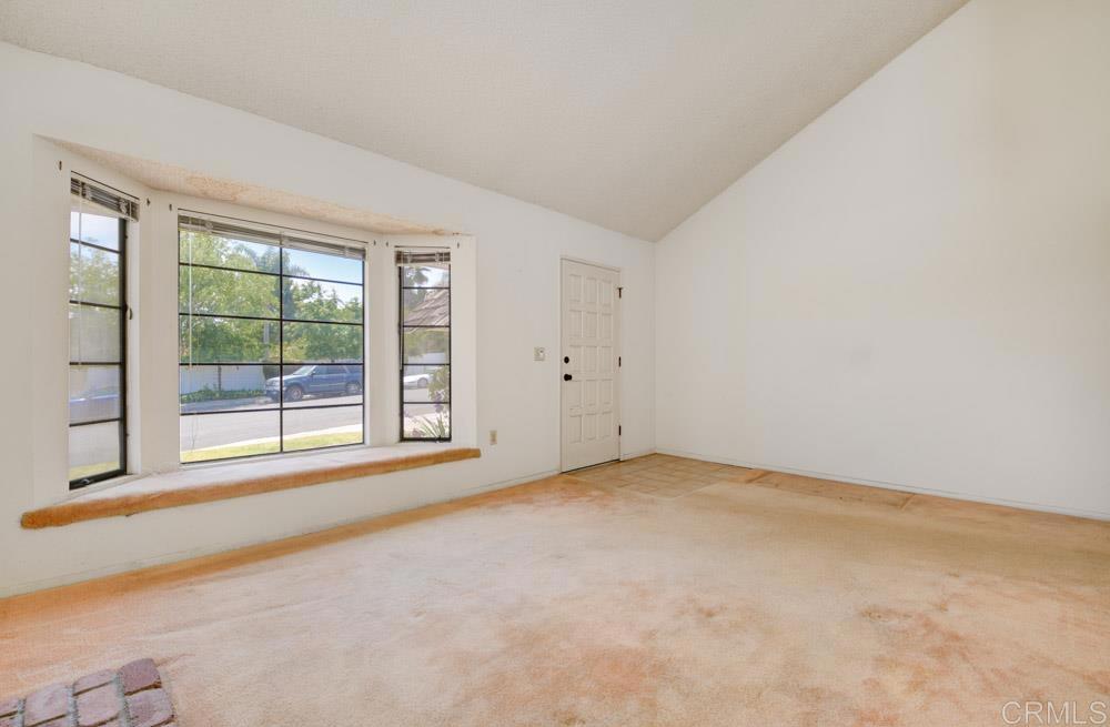 1706 Catalpa Road Carlsbad, CA 92011 - Photo 7 of 30 an empty room with windows