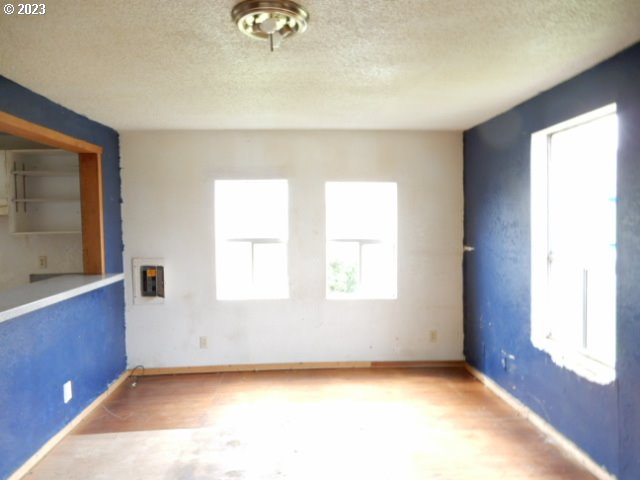 411 East 3rd Avenue Riddle, OR 97469 - Photo 3 of 21 a view of an empty room with a window