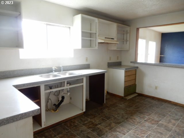 411 East 3rd Avenue Riddle, OR 97469 - Photo 5 of 21 a utility room with a sink washer and dryer
