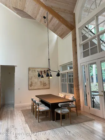 a outdoor dining space with furniture and wooden floor