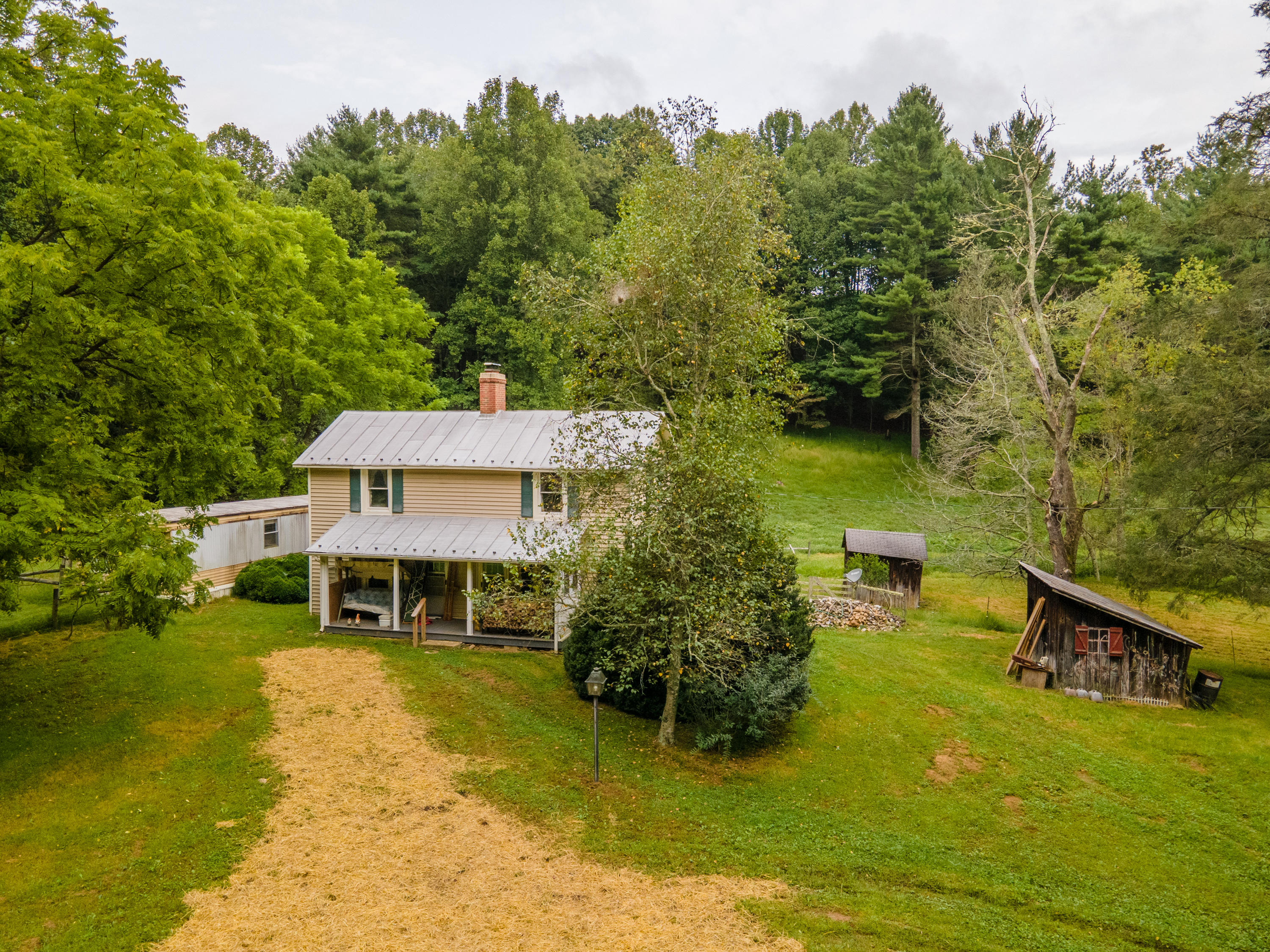 361 Wade Road Northwest Floyd, VA 24091 - Photo 1 of 48 an aerial view of a house with swimming pool garden and patio
