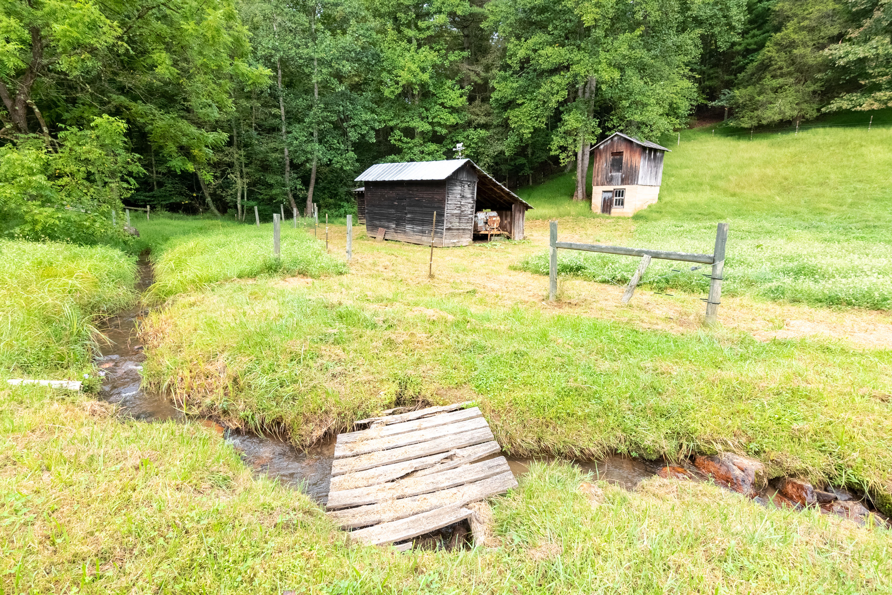 361 Wade Road Northwest Floyd, VA 24091 - Photo 18 of 48 a backyard of a house with a yard and outdoor seating