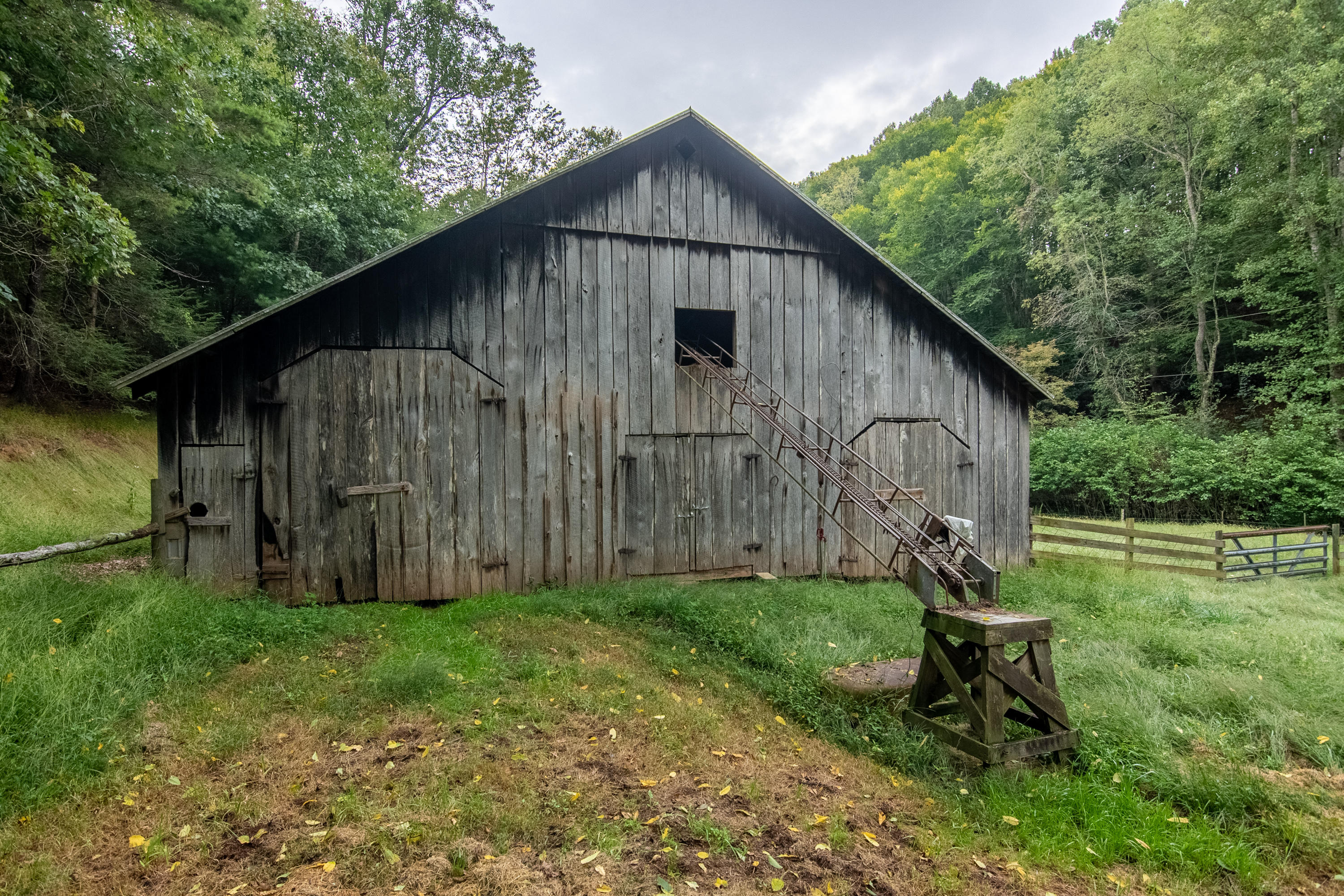 361 Wade Road Northwest Floyd, VA 24091 - Photo 24 of 48 a backyard of a house with table and chairs