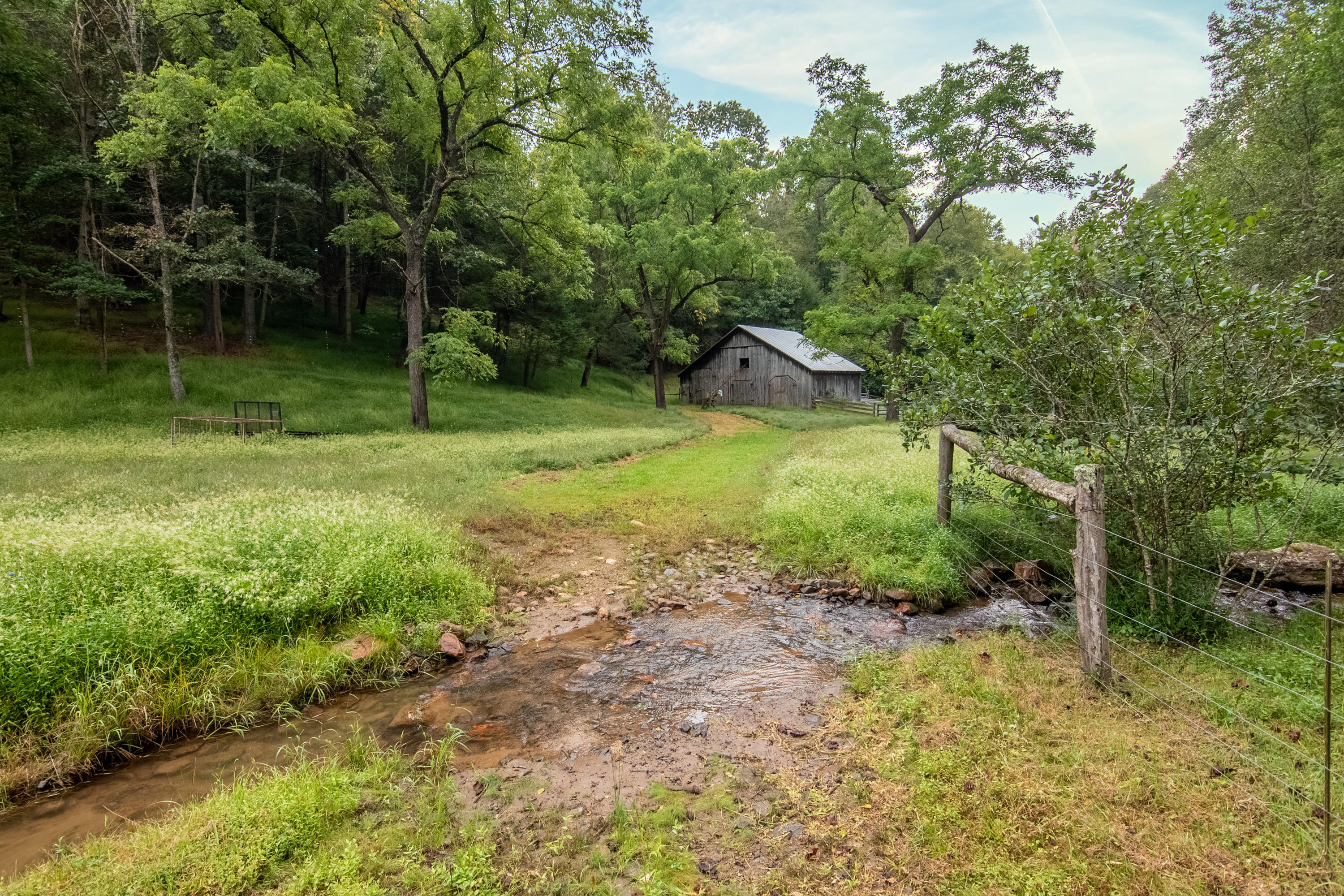 361 Wade Road Northwest Floyd, VA 24091 - Photo 27 of 48 a backyard of a house with plants and entertaining space