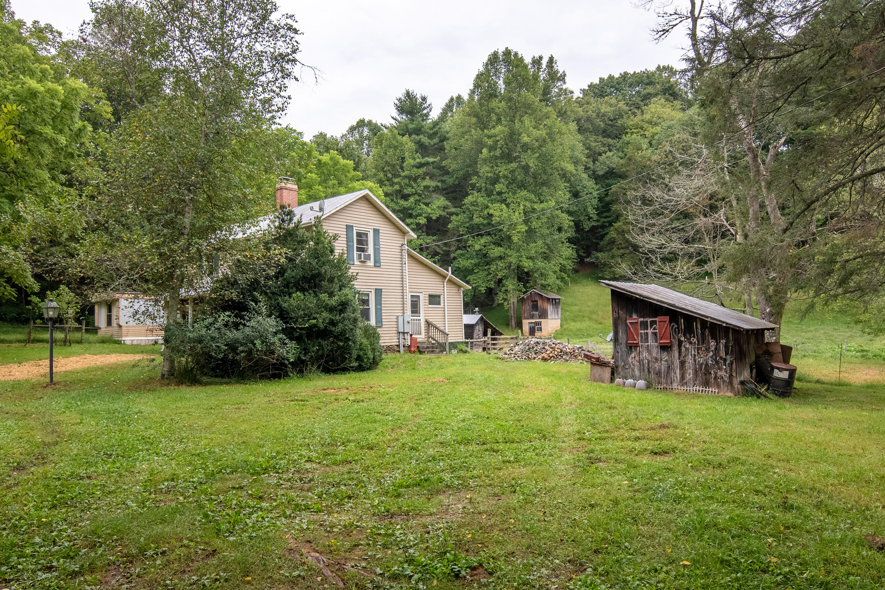 361 Wade Road Northwest Floyd, VA 24091 - Photo 32 of 48 a view of a house with a yard and sitting area