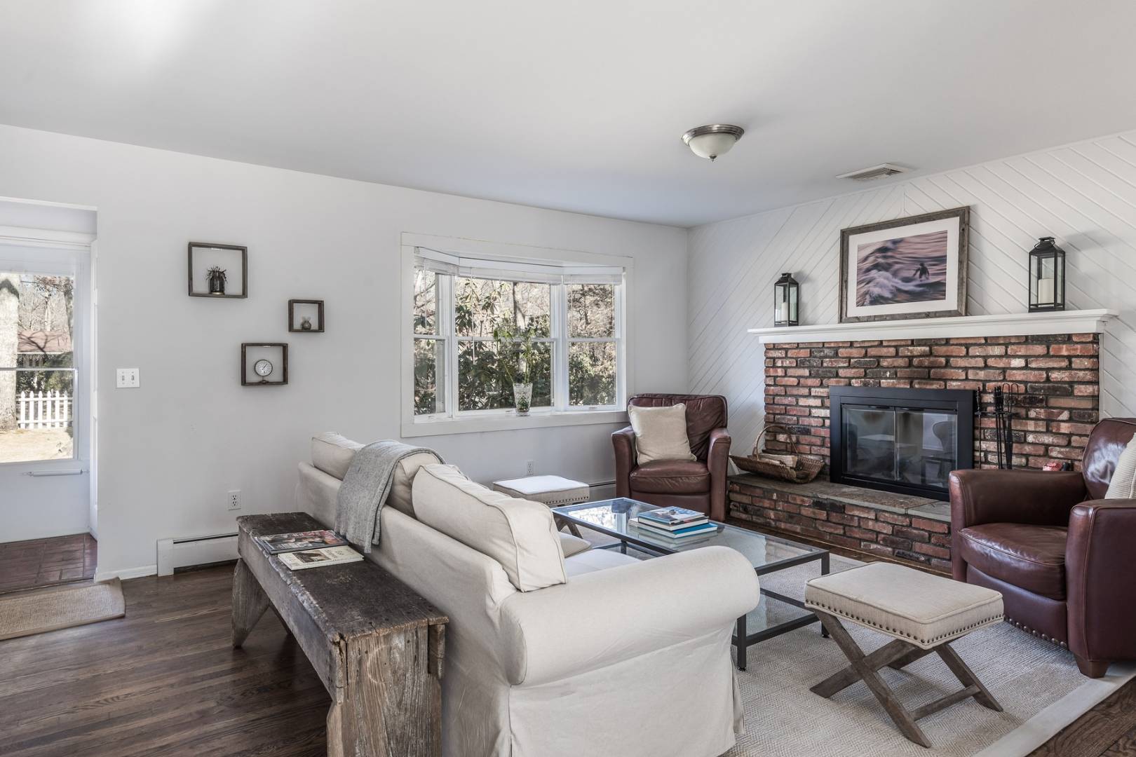 38 Glade Road East Hampton, NY 11937 - Photo 4 of 14 a living room with furniture and a fireplace