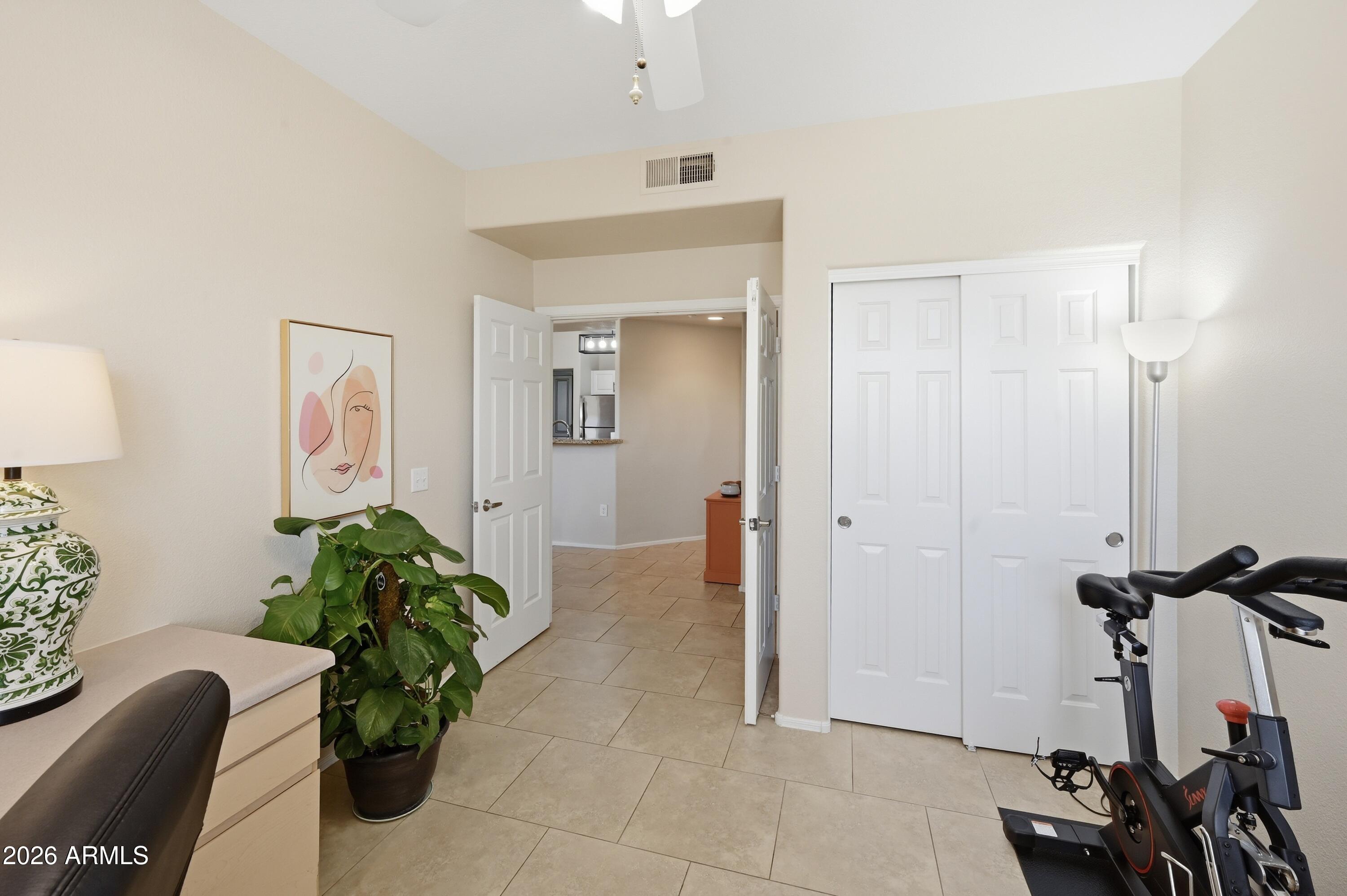 5303 North 7th Street, Unit 220 Phoenix, AZ 85014 - Photo 16 of 33 a living room with furniture and a potted plant