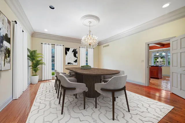 a living room with stainless steel appliances kitchen island granite countertop furniture and a large window