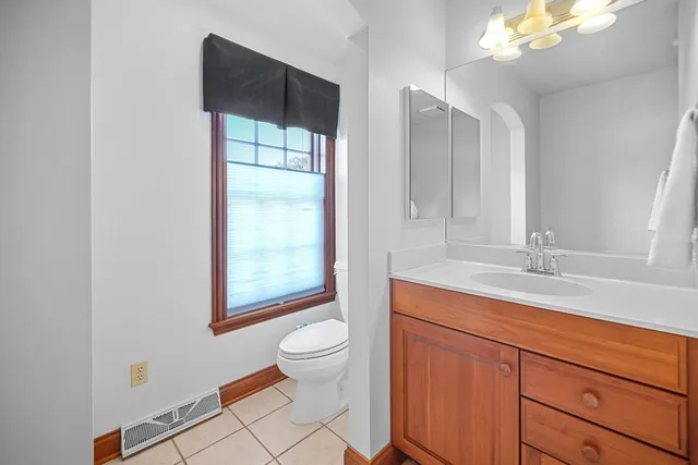 a bathroom with a double vanity sink a mirror and shower