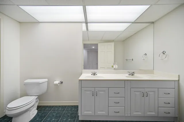 an aerial view of a house with garden space and street view