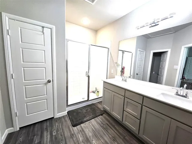 a view of entryway and dining room with wooden floor