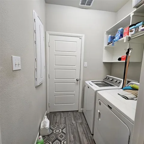 a bathroom with a double vanity sink and mirror