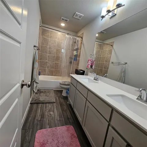 a bedroom with bed and windows