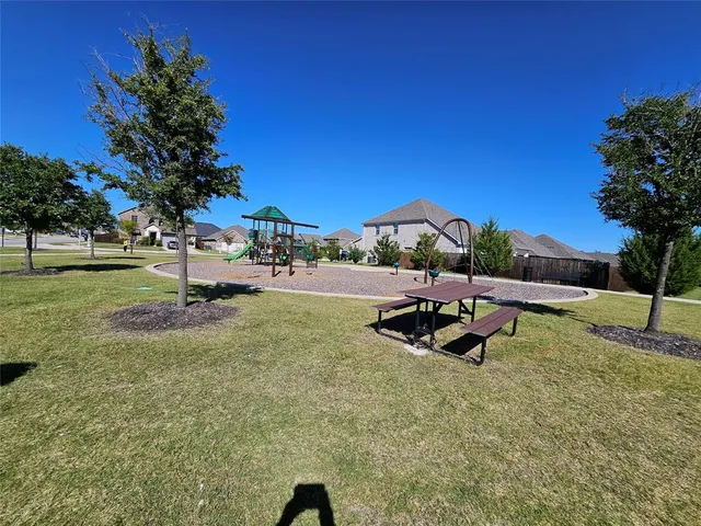 a view of a deck with a table and chairs with wooden floor