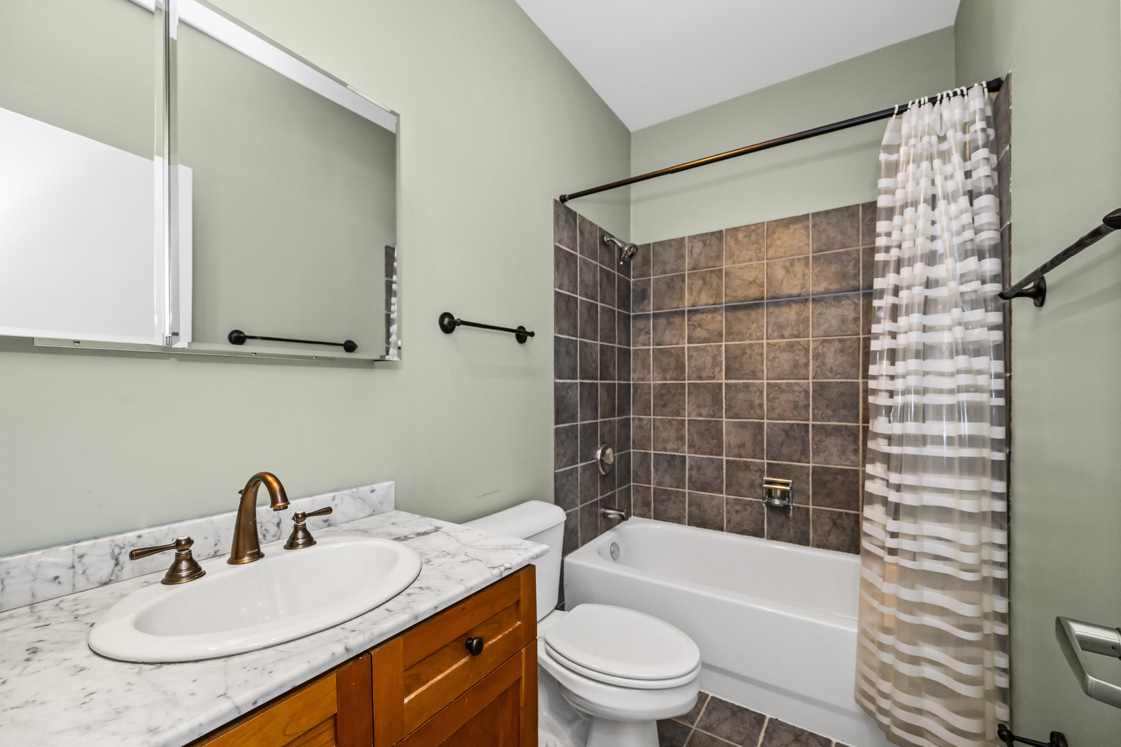 363 West Superior Street, Unit A Chicago, IL 60654 - Photo 12 of 18 a bathroom with a sink a toilet and bathtub