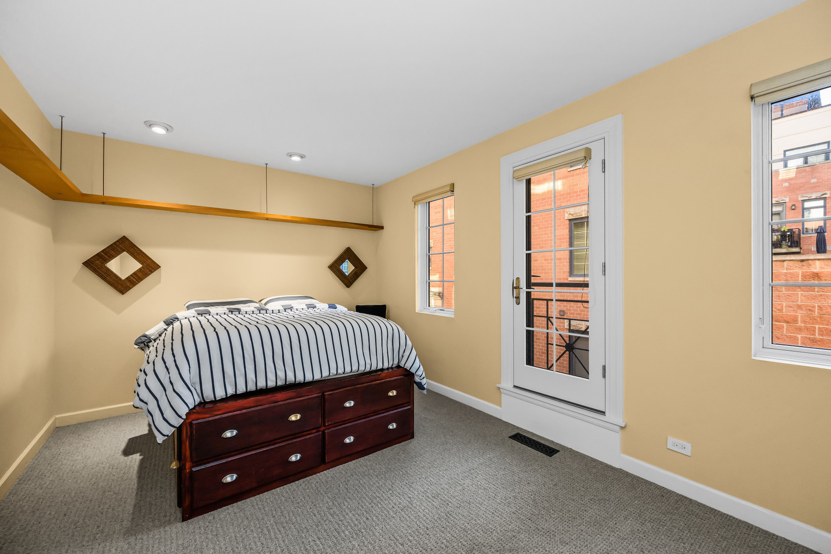 363 West Superior Street, Unit A Chicago, IL 60654 - Photo 9 of 18 a bedroom with a bed and a window