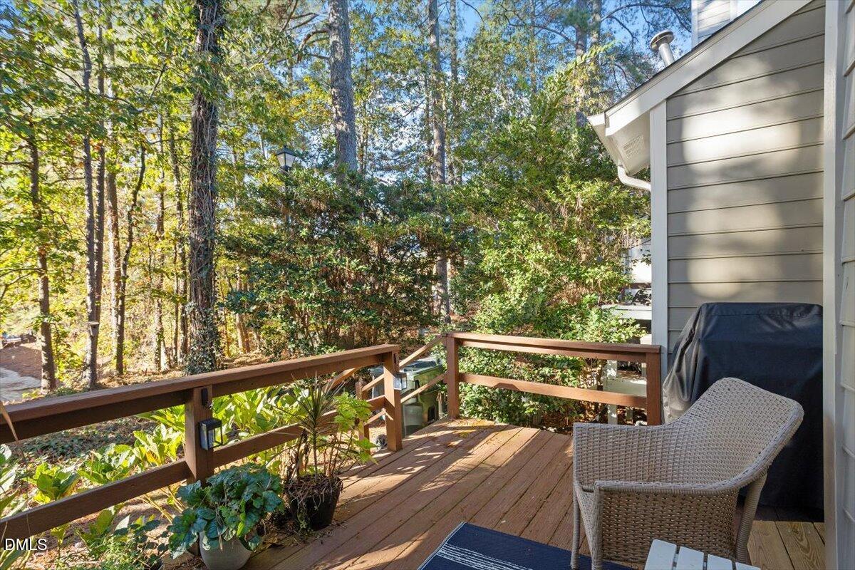 5442 Sharpe Drive Raleigh, NC 27612 - Photo 16 of 20 a view of balcony with wooden floor and outdoor seating