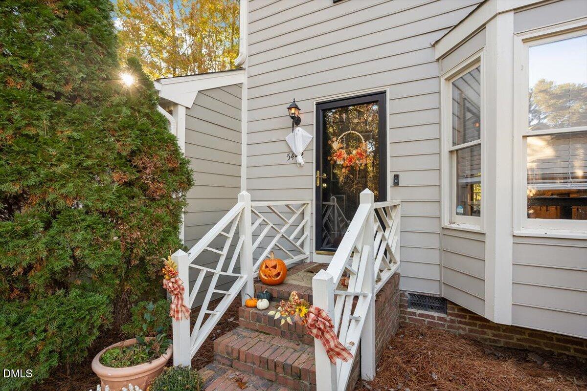 5442 Sharpe Drive Raleigh, NC 27612 - Photo 20 of 20 a view of an entryway with wooden floor and fence