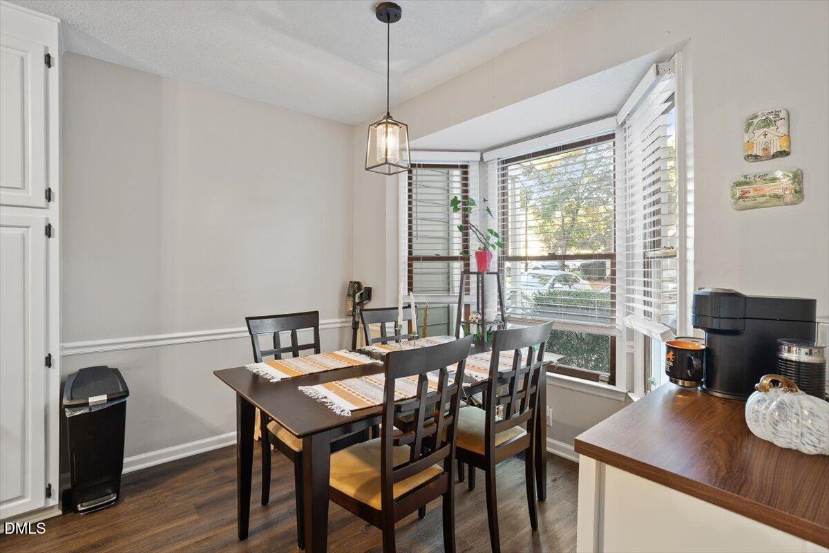 5442 Sharpe Drive Raleigh, NC 27612 - Photo 4 of 20 a view of a dining room with furniture window and outside view