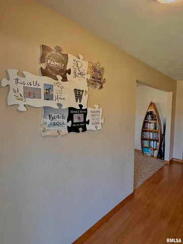 a bedroom with a bed dresser and a large mirror