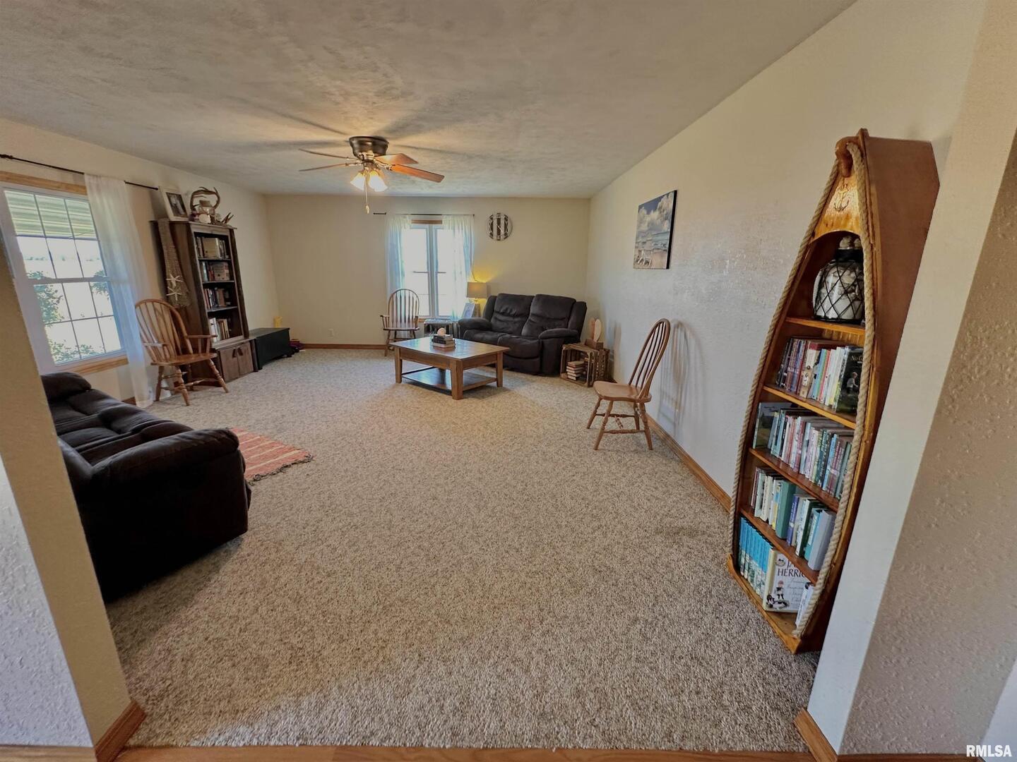 878 County Road 600N Sims, IL 62886 - Photo 22 of 82 a living room with furniture and a book shelf