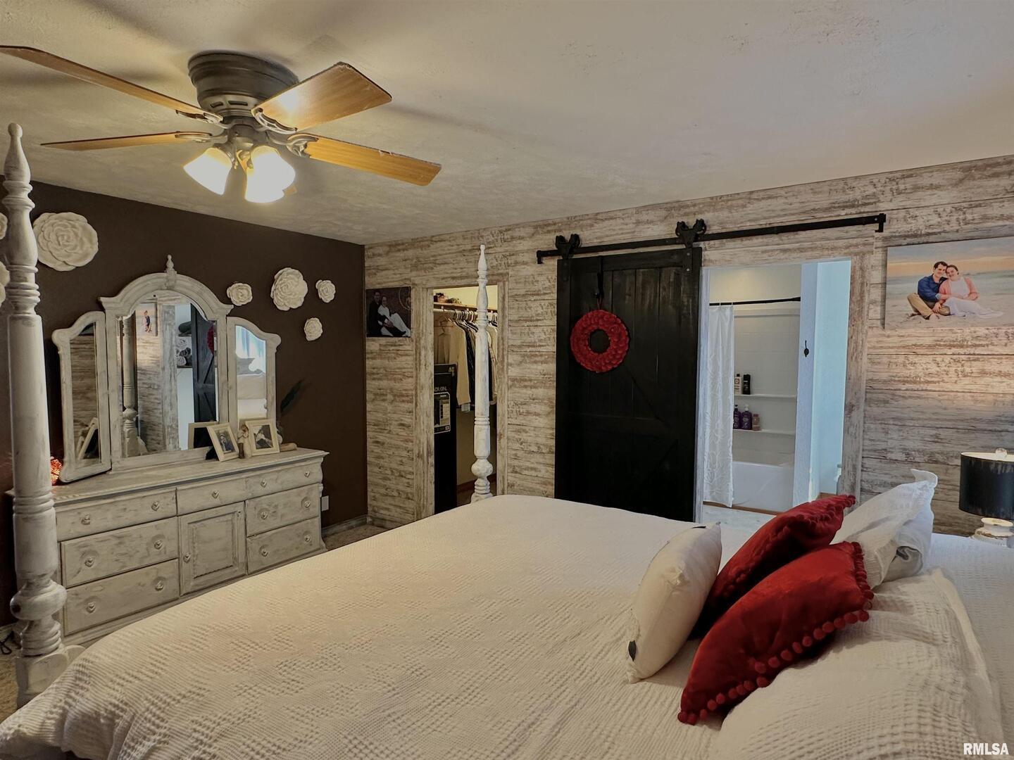 878 County Road 600N Sims, IL 62886 - Photo 28 of 82 a bedroom with a bed dresser and a large mirror