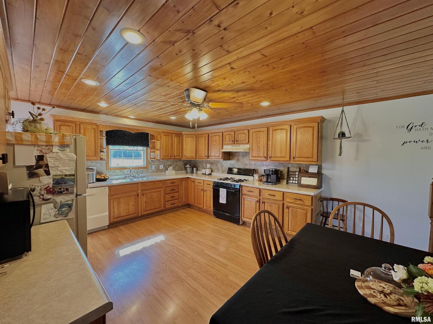 878 County Road 600N Sims, IL 62886 - Photo 3 of 82 a kitchen with stainless steel appliances granite countertop a sink a stove cabinets counter space and a window