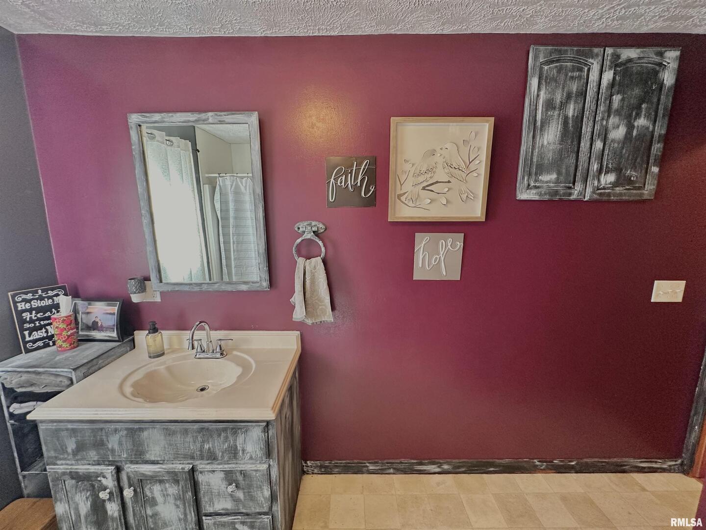 878 County Road 600N Sims, IL 62886 - Photo 40 of 82 a bathroom with a sink and a mirror