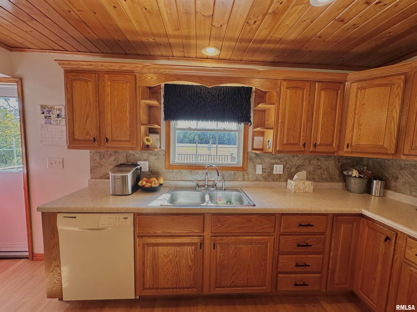 878 County Road 600N Sims, IL 62886 - Photo 44 of 82 a kitchen with granite countertop cabinets stainless steel appliances a sink and wooden floor