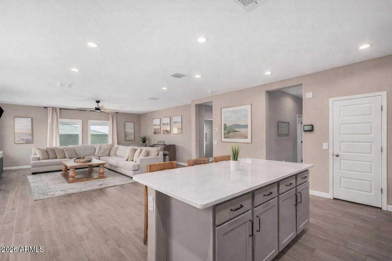 a view of kitchen with center island and wooden floor