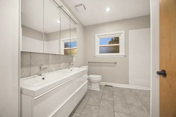 a bathroom with a sink a toilet and bathtub