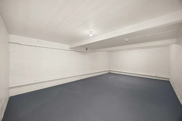 an empty room with a empty space and window