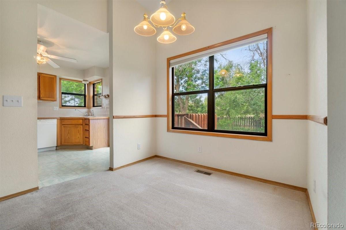 833 Wade Road Longmont, CO 80503 - Photo 12 of 40 an empty room with windows and closet