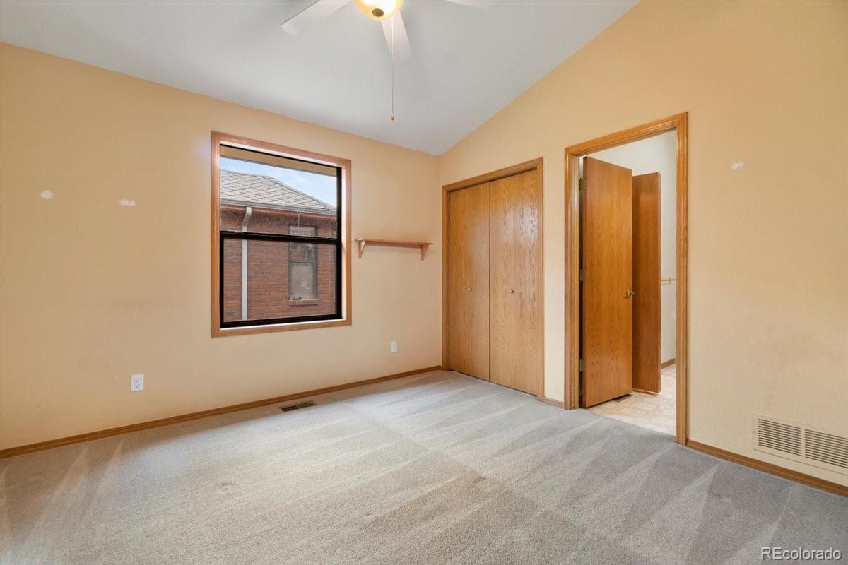 833 Wade Road Longmont, CO 80503 - Photo 18 of 40 an empty room with windows and closet
