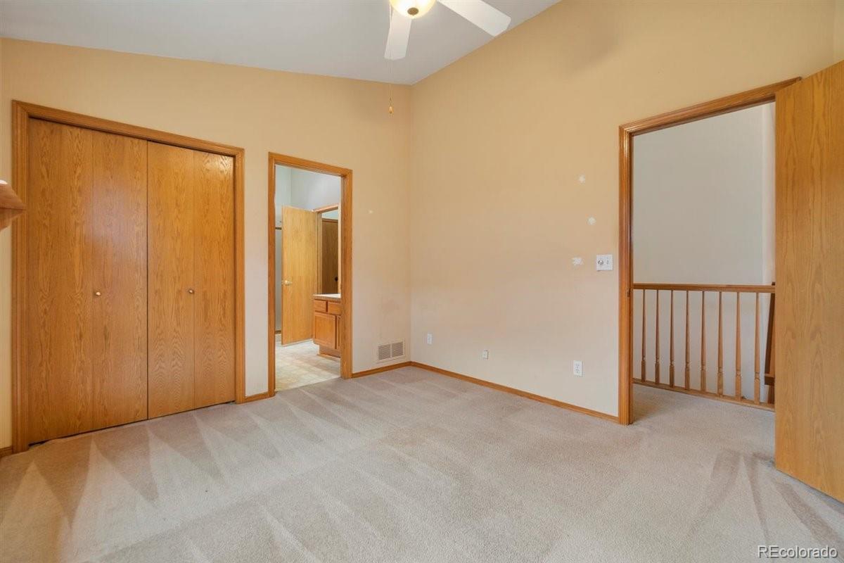 833 Wade Road Longmont, CO 80503 - Photo 19 of 40 a view of an empty room with a window