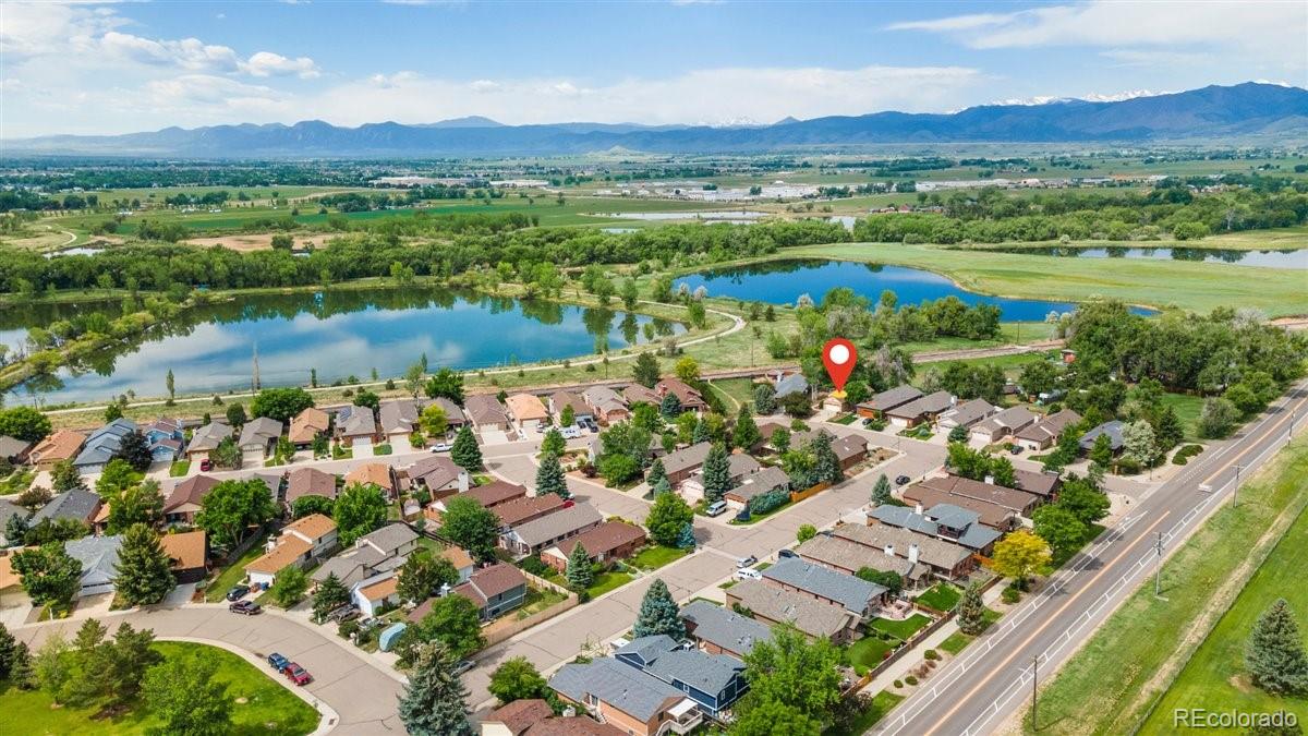 833 Wade Road Longmont, CO 80503 - Photo 2 of 40 a view of lake and mountain