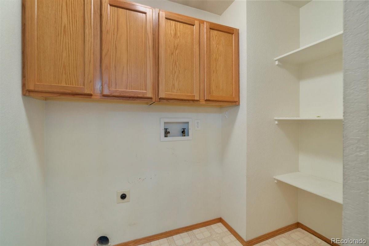 833 Wade Road Longmont, CO 80503 - Photo 22 of 40 a view of walk in closet with rug
