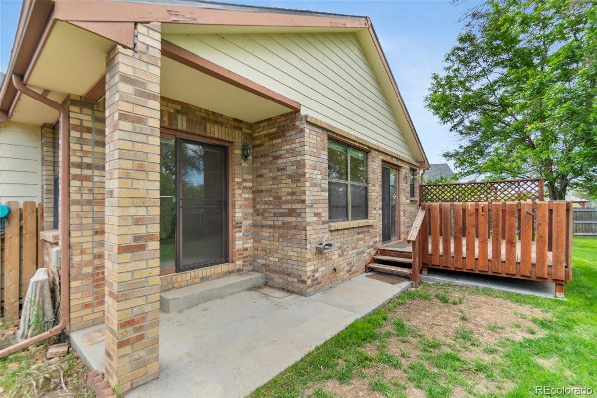 833 Wade Road Longmont, CO 80503 - Photo 32 of 40 a view of a house with a backyard