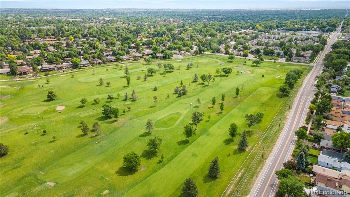 833 Wade Road Longmont, CO 80503 - Photo 35 of 40 an aerial view of residential houses with outdoor space and trees