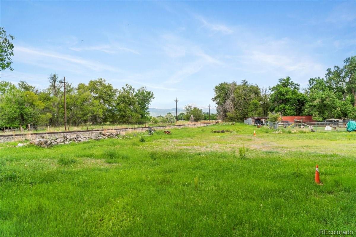 833 Wade Road Longmont, CO 80503 - Photo 36 of 40 a view of a park with large trees