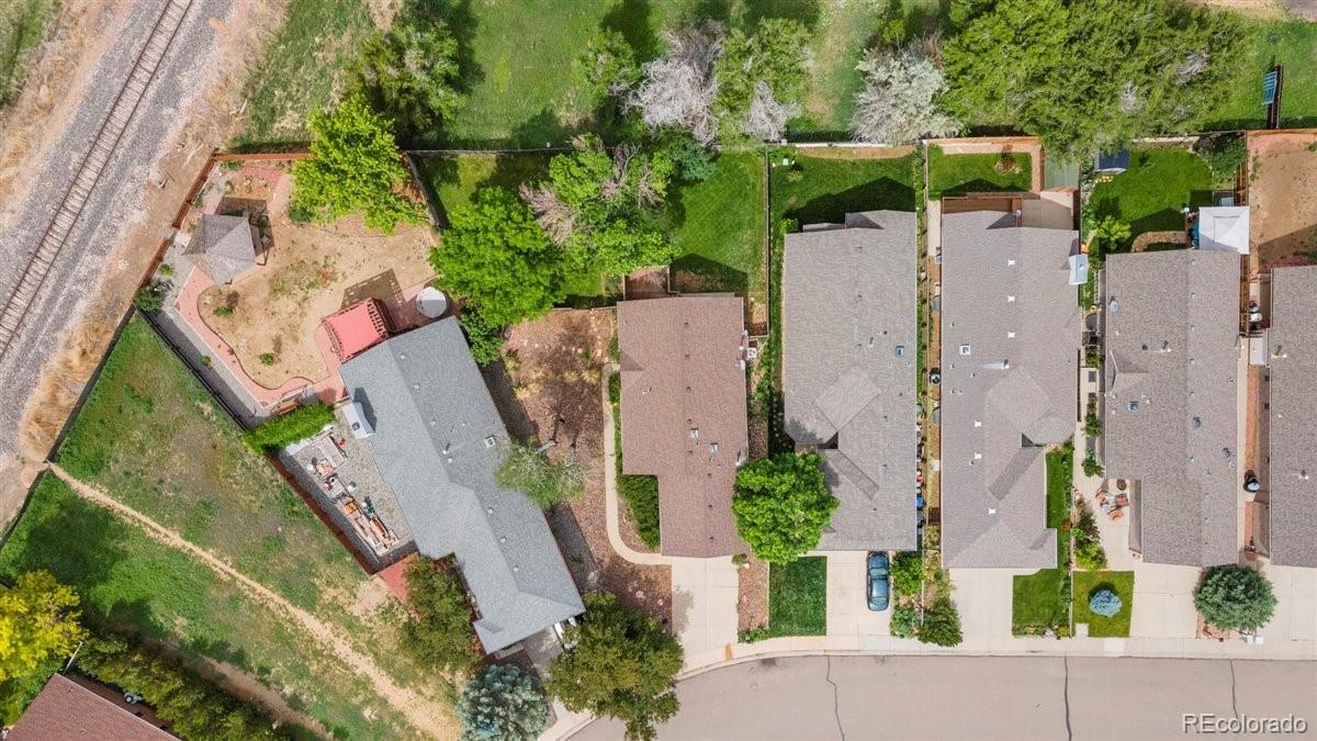 833 Wade Road Longmont, CO 80503 - Photo 38 of 40 an aerial view of a house with a yard and trees
