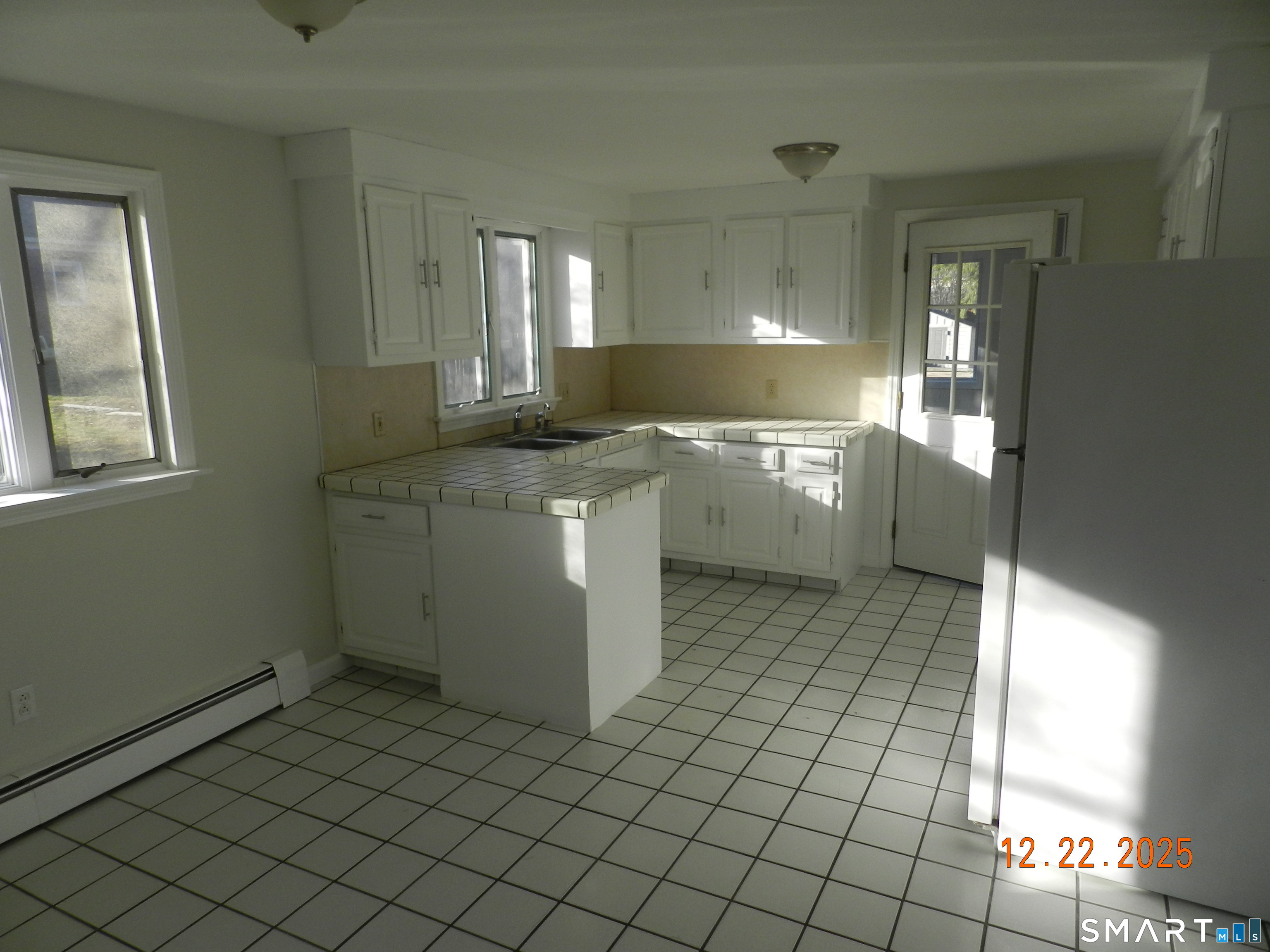 10 Poplar Street Windsor Locks, CT 06096 - Photo 3 of 9 a kitchen with a sink and cabinets