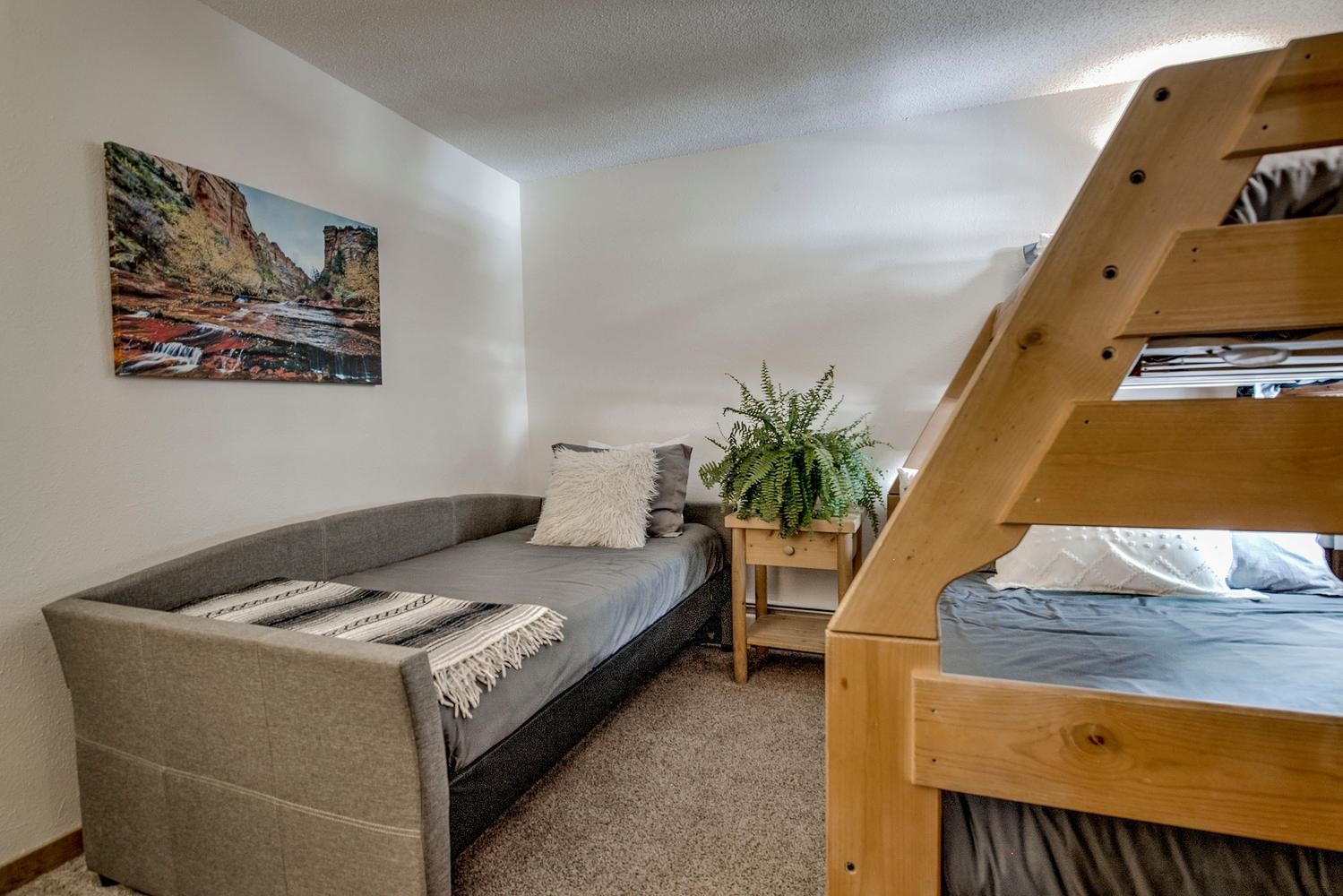 1075 Ski Hill Road, Unit 46 Breckenridge, CO 80424 - Photo 18 of 41 a bedroom with a bed and a potted plant