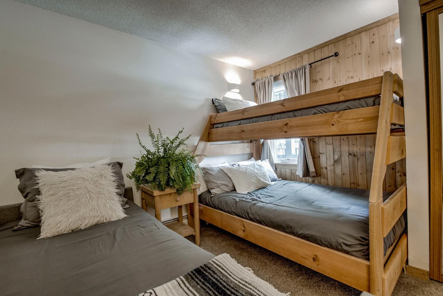 1075 Ski Hill Road, Unit 46 Breckenridge, CO 80424 - Photo 19 of 41 a bedroom with a bed and potted plant