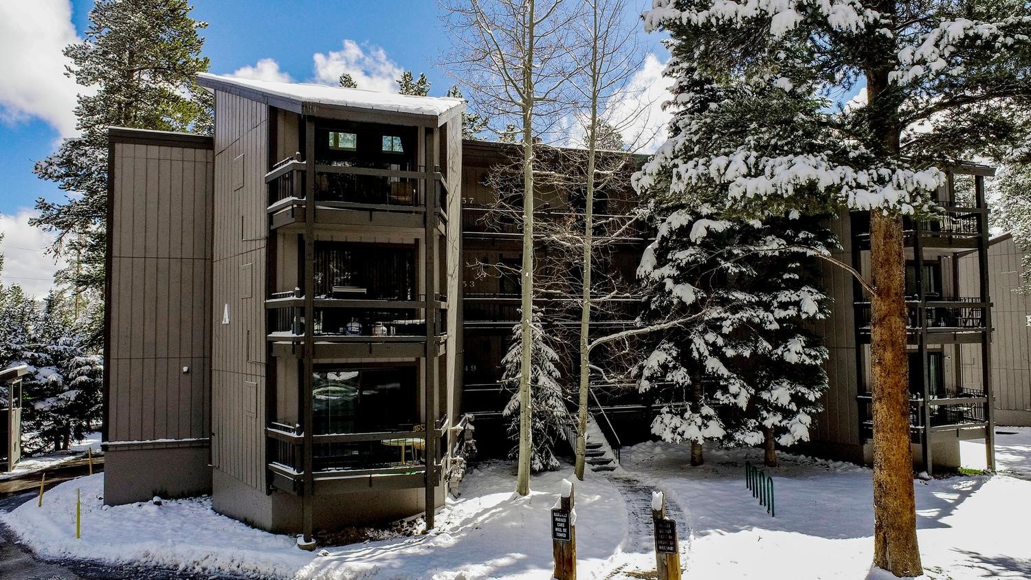 1075 Ski Hill Road, Unit 46 Breckenridge, CO 80424 - Photo 28 of 41 a view of a house with a door and car parked