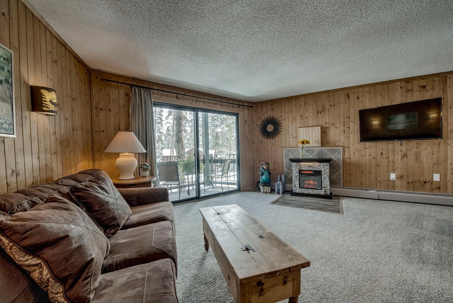 1075 Ski Hill Road, Unit 46 Breckenridge, CO 80424 - Photo 4 of 41 a living room with furniture and a flat screen tv