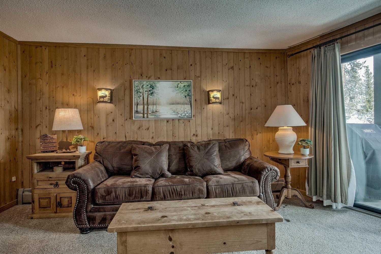 1075 Ski Hill Road, Unit 46 Breckenridge, CO 80424 - Photo 5 of 41 a living room with furniture and a fireplace